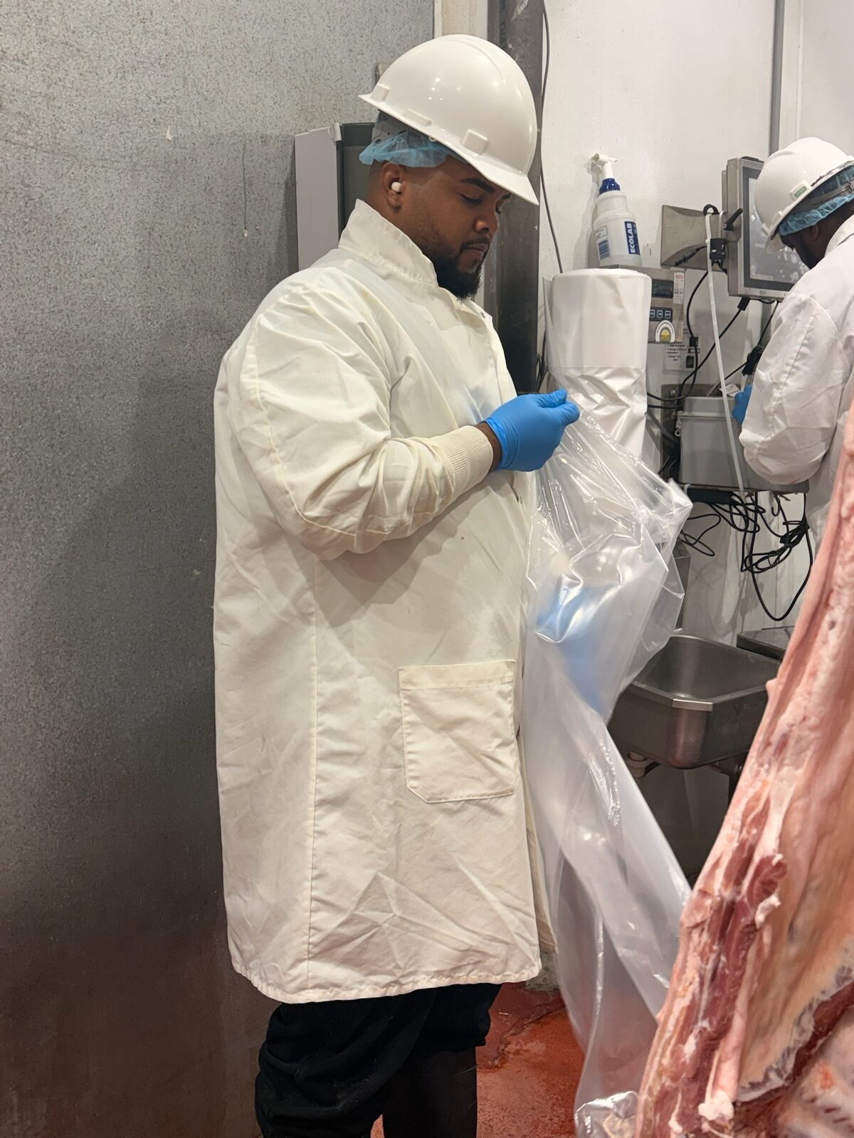 Mary's Ranch staff in full protective gear inside the USDA-inspected facility